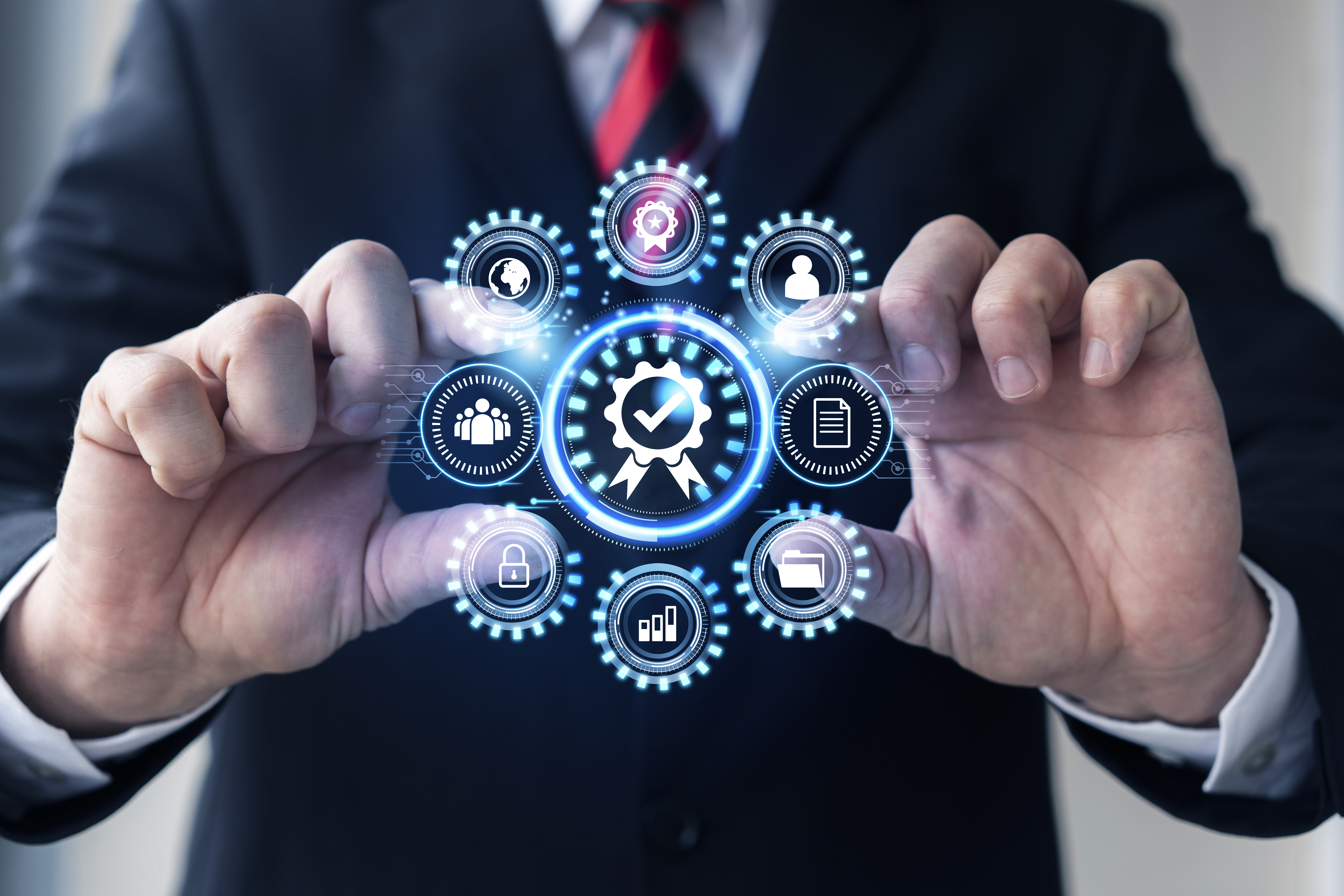Hands interacting with digital interface showing icons for HR automation software functions like employee records, compliance, and data security